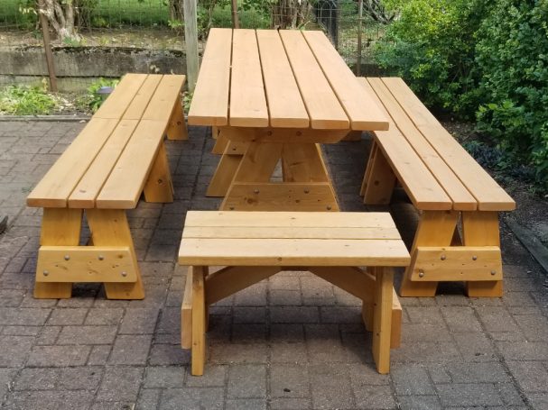 Commercial quality Custom Eco-friendly Outdoor Detached Bench Picnic Table with six benches from the front on a patio.