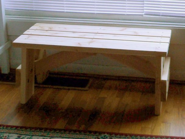 Commercial quality eco-friendly Outdoor Picnic Table Bench slanted slightly to the left in a house.