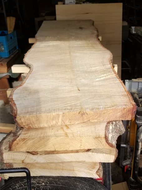 High Grain Brewery pine log slabs used to make a Handcrafted Pine Log Live Edge Slab Bench.