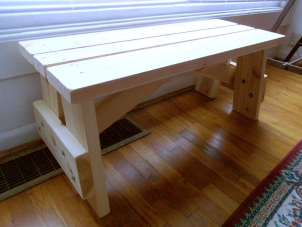 Commercial quality eco-friendly Outdoor Picnic Table Bench slanted slightly to the right in a house.