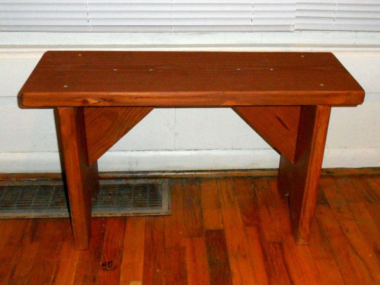 Front of a Commercial quality Outdoor Farmhouse Bench slanted in a house.