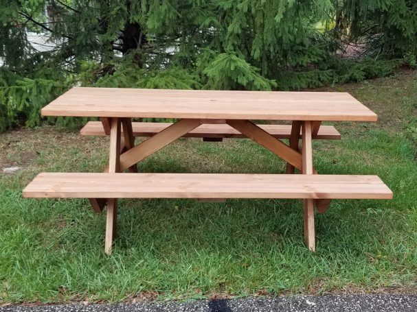 Commercial quality eco-friendly Outdoor Attached Bench Picnic Table from the side in a backyard.