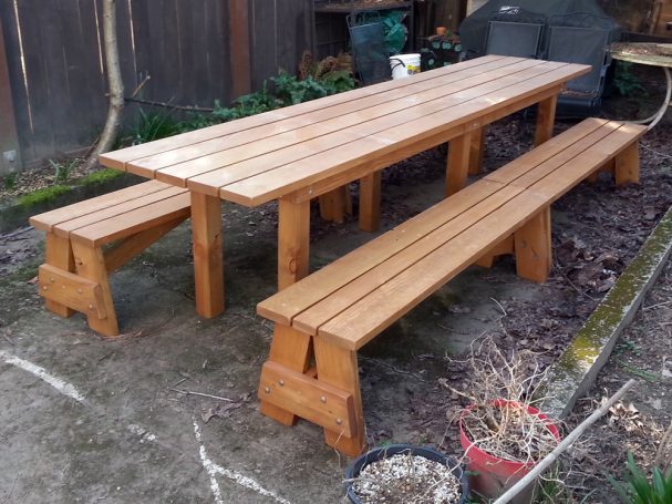 Extra-long aproned Commercial quality Custom Eco Outdoor Detached Bench Picnic Table with four benches in a backyard.