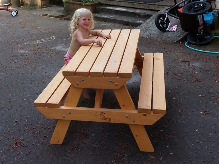Little girl sitting at a Commercial quality Eco-friendly Outdoor Kids Attached Bench Picnic Table from the front.