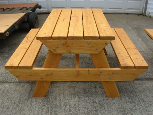4' Commercial quality eco-friendly Outdoor Attached Bench Picnic Table from the front on a sidewalk.