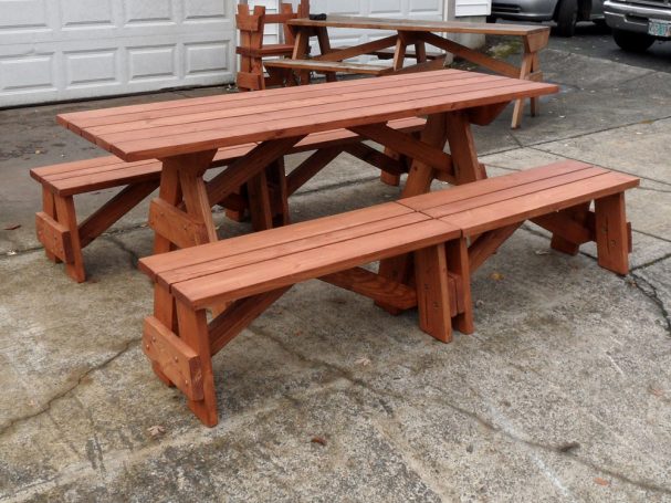 Commercial quality Custom Eco-friendly Outdoor Detached Bench Picnic Table with four benches slanted right on sidewalk.