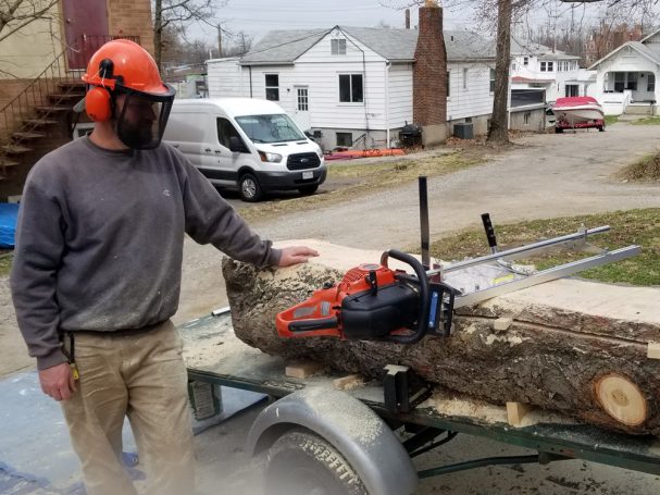 High Grain Brewery pine log being cut into slabs for a Handcrafted Pine Log Live Edge Slab Bench.