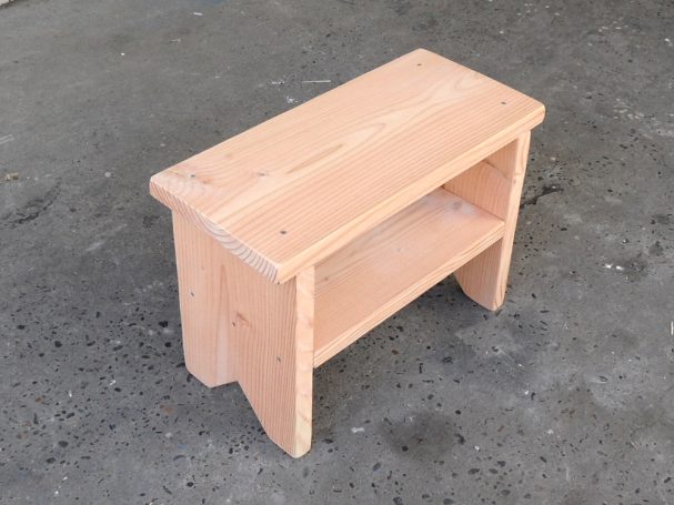 Small Commercial quality eco-friendly Outdoor Farmhouse Bench with a shelf slanted to the right.
