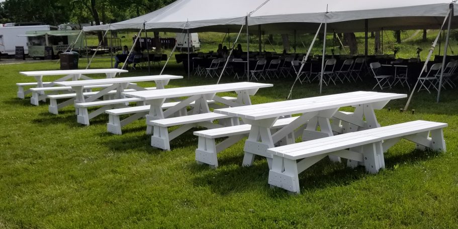 Four Large Commercial quality Custom Eco Outdoor Detached Bench Picnic Tables with four benches in a row at craft show.