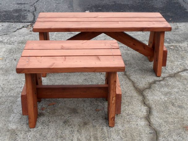 Front view of a short and a medium Commercial quality eco-friendly Outdoor Picnic Table Bench on the sidewalk.