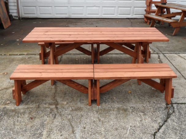 Commercial quality Custom Eco-friendly Outdoor Detached Bench Picnic Table with four benches from the side on sidewalk.