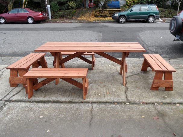 Front of a Commercial Custom Eco-friendly Outdoor Detached Bench Picnic Table with four benches arranged uniquely.