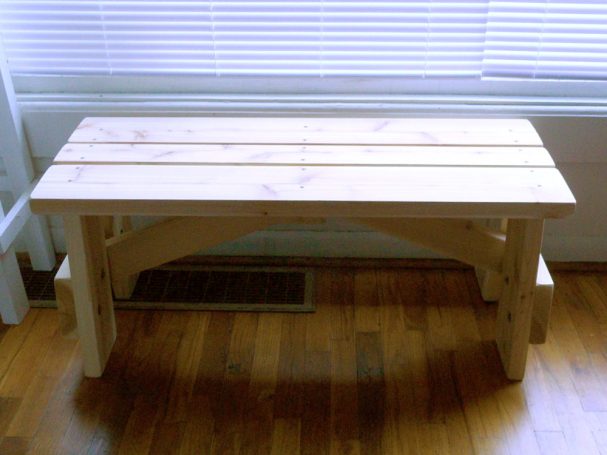 Front view of a Commercial quality eco-friendly Outdoor Picnic Table Bench in a house.