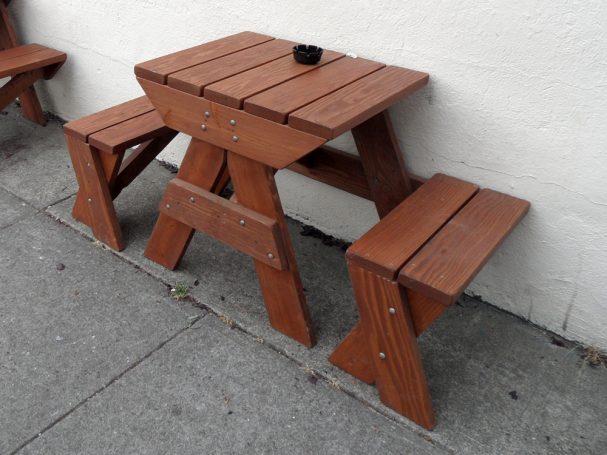 Small Commercial quality Custom Eco-friendly Outdoor Hybrid Bench Picnic Table on a restaurant bar sidewalk.