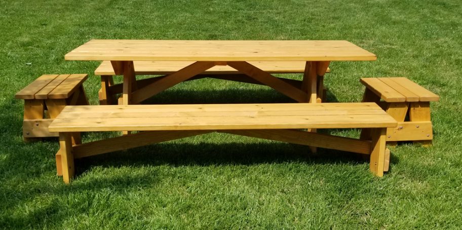 Commercial quality Custom Eco-friendly Outdoor Detached Bench Picnic Table with six benches from the side in a backyard.