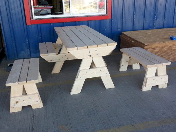 7' Commercial quality Custom Eco Outdoor Hybrid Bench Picnic Table with two benches slanted left at a restaurant bar.