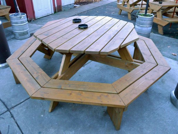 Commercial quality Custom Eco-friendly Outdoor Octagon Attached Bench Picnic Table on a restaurant bar patio.