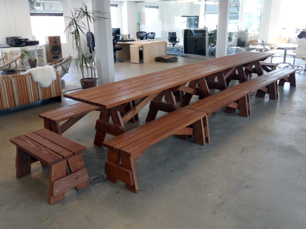 Two Large Commercial quality Custom Eco Outdoor Detached Bench Picnic Tables with five benches in a row at an office.