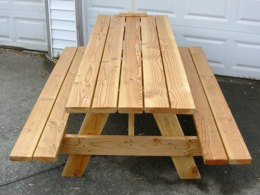 Clear stain color option on a 7' Commercial quality eco-friendly Outdoor Attached Bench Picnic Table on a sidewalk.
