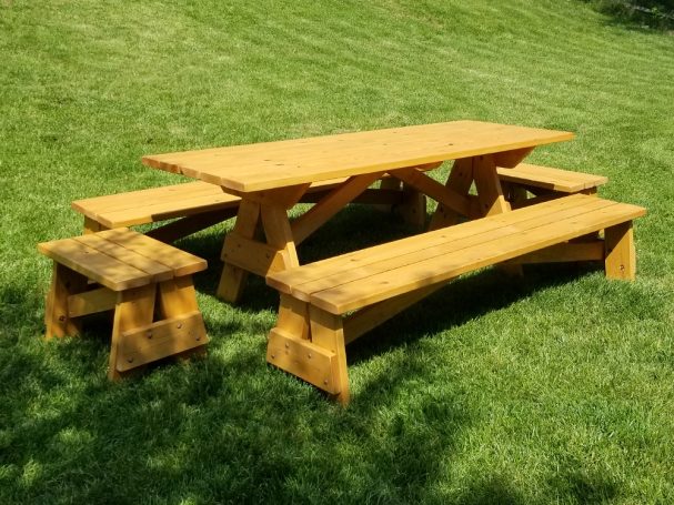 Commercial quality Custom Eco-friendly Outdoor Detached Bench Picnic Table with six benches slanted right in a backyard.
