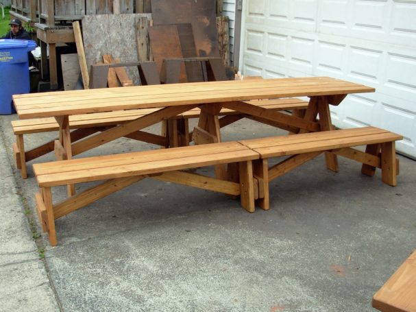 Large Commercial quality Custom Eco Outdoor Detached Bench Picnic Table with four benches slanted right on a sidewalk.