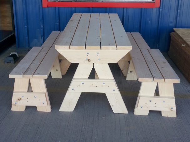 7' Commercial quality Custom Eco Outdoor Hybrid Bench Picnic Table with two benches from the front at a restaurant bar.